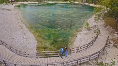 Drones shot of couple who is walking to a wonderful view of Slovenian Alps Video stock 90197701