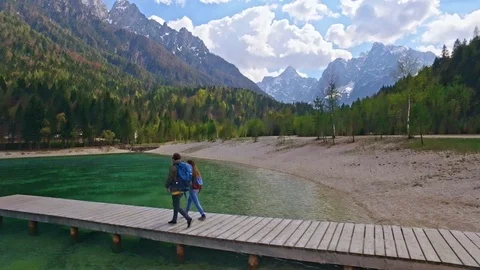 Drones shot of couple who is walking to a wonderful view of Slovenian Alps Video stock 90200161