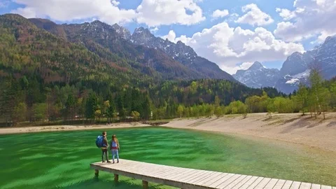 Drones shot of couple who is walking to a wonderful view of Slovenian Alps Video stock 90200545