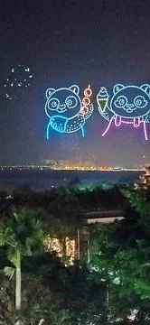 Drones in the sky displaying two panda bears Stock-Fotos
