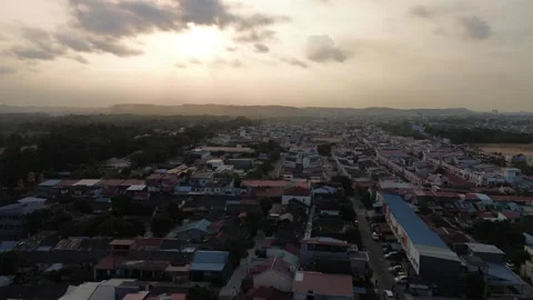 Drone's soaring view reveals a vast Indonesian neighborhood illuminated by .. Video stock 339037550