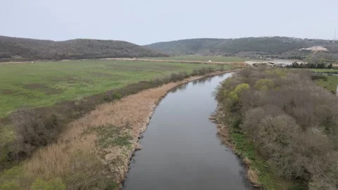 Drone's Tranquil Flight Over a Quiet River Stock Footage 305666953