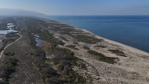 A Drone's Traversal Above a Slender Coastal Ridge Stock Footage 314069583