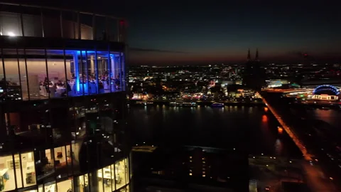 Droneshot of a dinner party in a skyscraper in Cologne at night Video stock 234612718