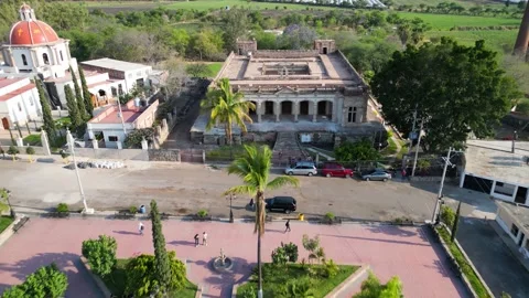 Dronie aerial shot pulling away from Ex-Hacienda Cofradia de la Luz in rural Stock Footage 318734691