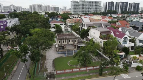 'Dronie' shot of an old house in Mountbatten, Singapore Stock Footage 138513899