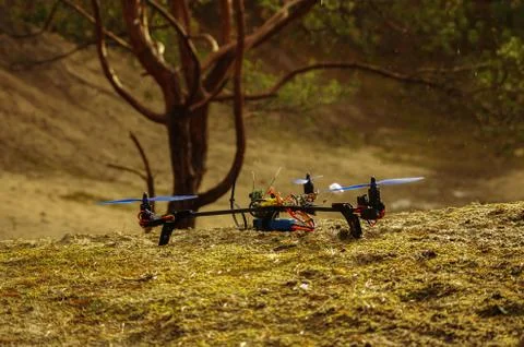Drons in the forest trying to start a flight, flying in the mud. Stock Photos