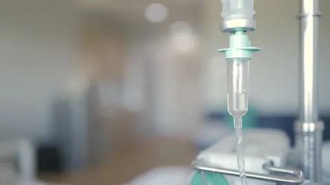 Drop of 0.9% Saline solution or NSS fluid from IV bag. Stock Footage 229066781