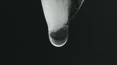 Drop being formed on a melting icicle Stock Footage 308933023