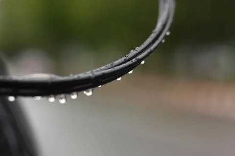 Drop on black wire macro view Stock Photos