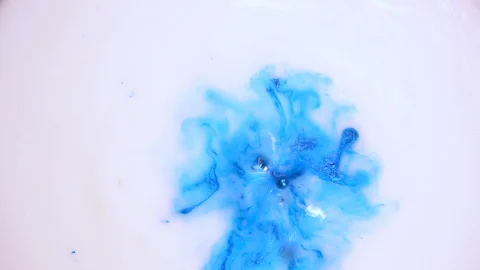 Drop of Blue Paint into a White Liquid 스톡 동영상 123735512