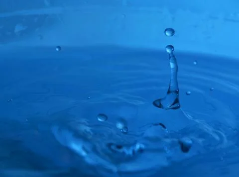 Drop of blue water Stock Photos