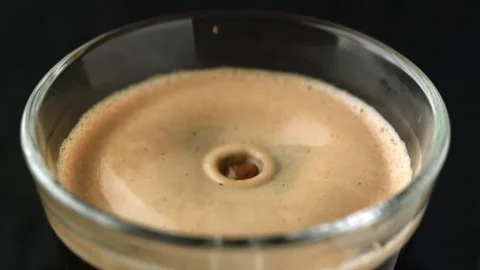 Drop of coffee fall on espresso Stockbeeldmateriaal 81807406