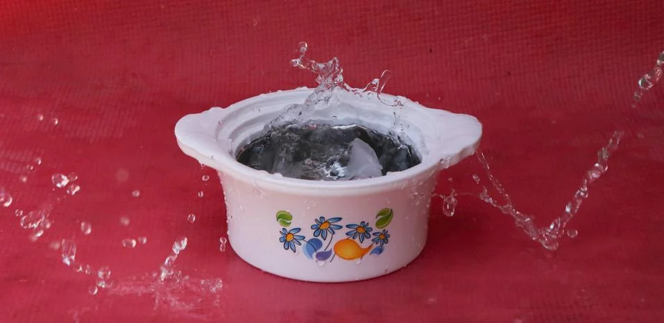 Drop of cold water splash Stock Photos