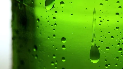 Drop of condensate drips on beer bottle glass Full HD close-up slow-motion video Vidéo 83143203