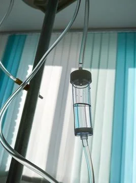 Drop counter against the background of window of the hospital ward. Stock Photos