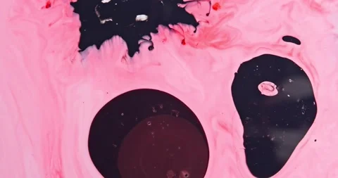 A drop of dark paint drips into the water and spreads Video stock 158454366