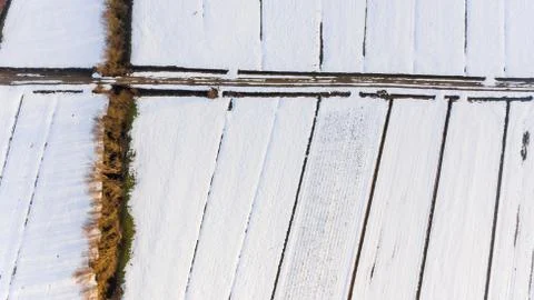 Drop down view of snow covered fields. Stock Photos