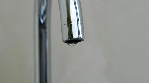 A drop drips from the kitchen faucet. Stock Footage 86800982