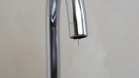 A drop drips from the kitchen faucet. Stock Footage 87565784
