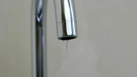 A drop drips from the kitchen faucet. Stock Footage 87566300