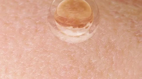 Drop a drop of cream or serum onto the face to bring moisture and radiance t Stock Footage 152867448