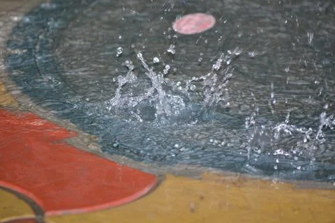 Drop drop from a height into the water macro photo Stock Photos