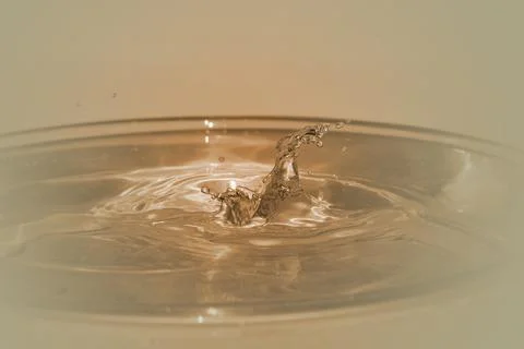 Drop drop from a height into the water macro photo Stock Photos