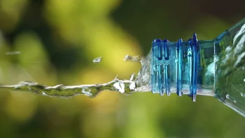 Drop a drop of water from an empty plastic bottle. Stock Footage 93707196