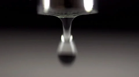 Drop by Drop of Water falling from Tap against White background, Real Time Stock Footage