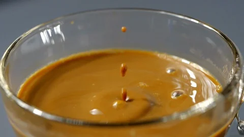 Drop of espresso falls into the filled Cup from the coffee machine Stock-Footage 113595578