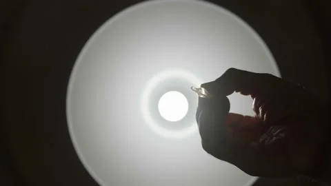 Drop of an eye drop falling on the eye of a patient, POV Stock Footage 143773010