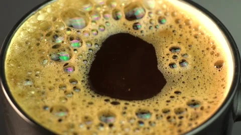 Drop Falling Into A Cup Of Coffee In Super Slowmotion. Vidéo 145984795