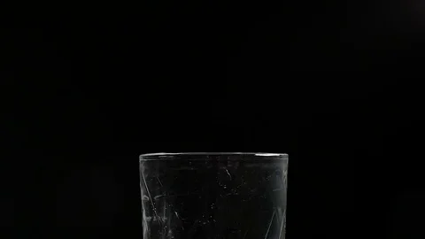 Drop falling into a glass of water Stock Footage 74343702