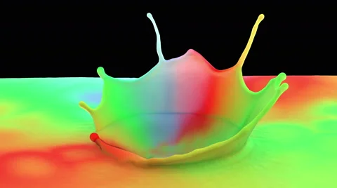 Drop falling in slow motion in color paint and making beautiful crown splash Stock Footage 59737820