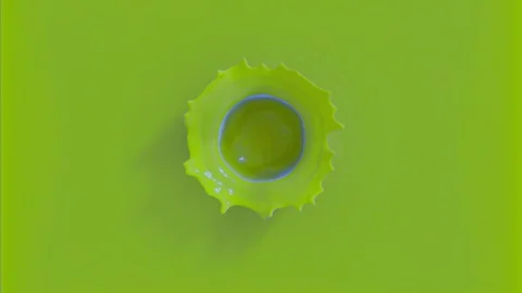 Drop falling in slow motion in green paint and making beautiful crown splash Stock Footage 109624985