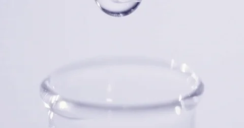 Drop is falling into test tube close up Video stock 74853858