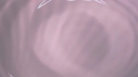 Drop falling into water and diverging circles of water in slow motion Stock Footage 230896863