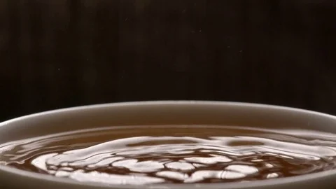 Drop falls into a cup Stock Footage 71803712