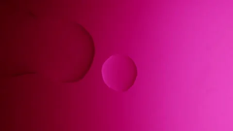 A drop flows and connects with a small one on a pink gradient background Stockbeeldmateriaal 303061136