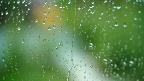 A drop flows down a wet window on a rainy day, close-up Stock Footage 267944827