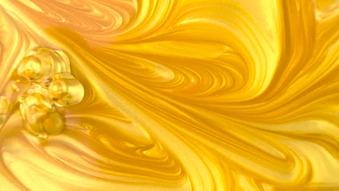 Drop of golden ink liquid macro shot Stock Footage 165460863