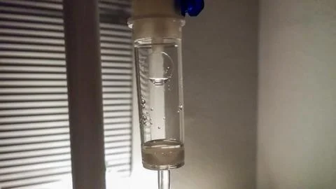 Drop hanging in the flow Stock Photos