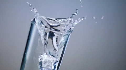 Drop Ice Cube in Water Glass Stock-Footage 63624129