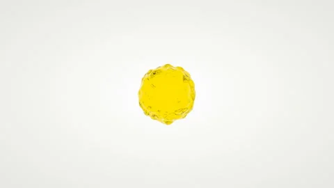 A drop of juice in rotation is sprayed on a white background. Stock-Footage 127270955