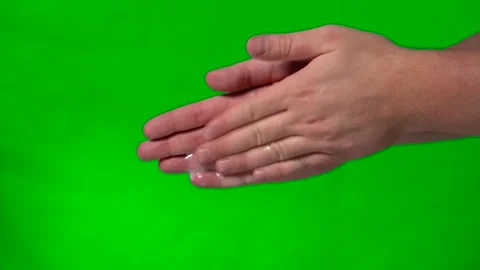 A drop of liquid soap falls into men's hands on a green background Video stock 145196906