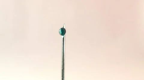 Drop of medication at the needle end of the syringe Stock Footage 16311559