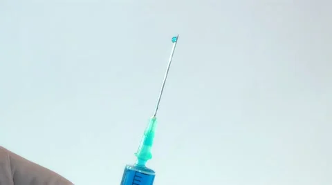 Drop of medication at the needle end of the syringe Stock Footage 16314716