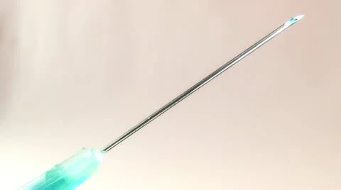Drop of medication at the needle end of the syringe Stock Footage 16327518
