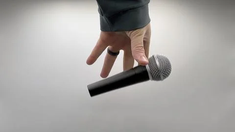 Drop the Mic on Sequence - Male Hand Black Mic Stock-Fotos